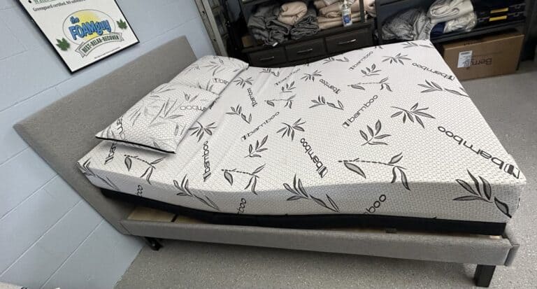 Bamboo mattress on grey bedframe in showroom.