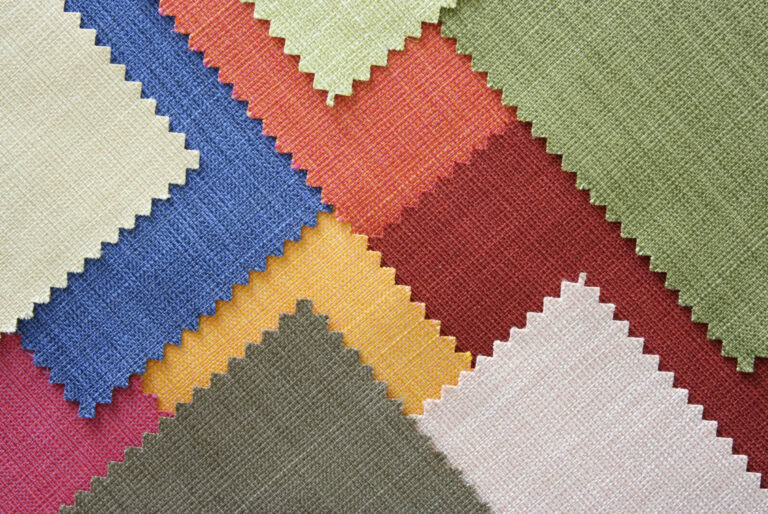 Assorted colourful fabric swatches with zigzag edges.