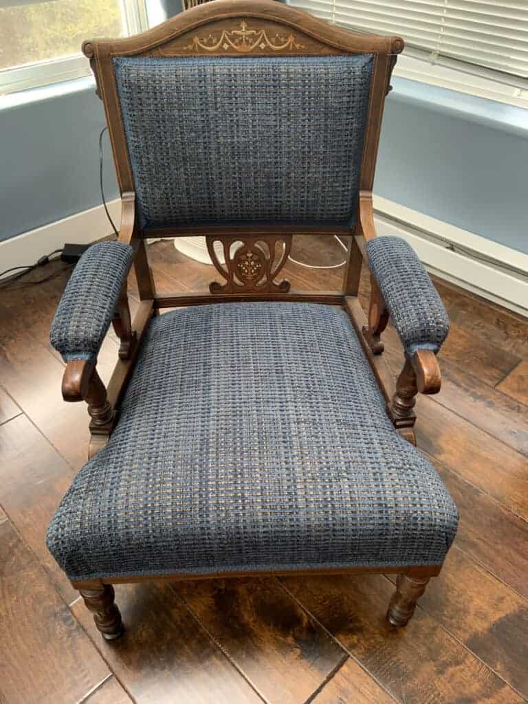 Vintage wooden chair with blue upholstery