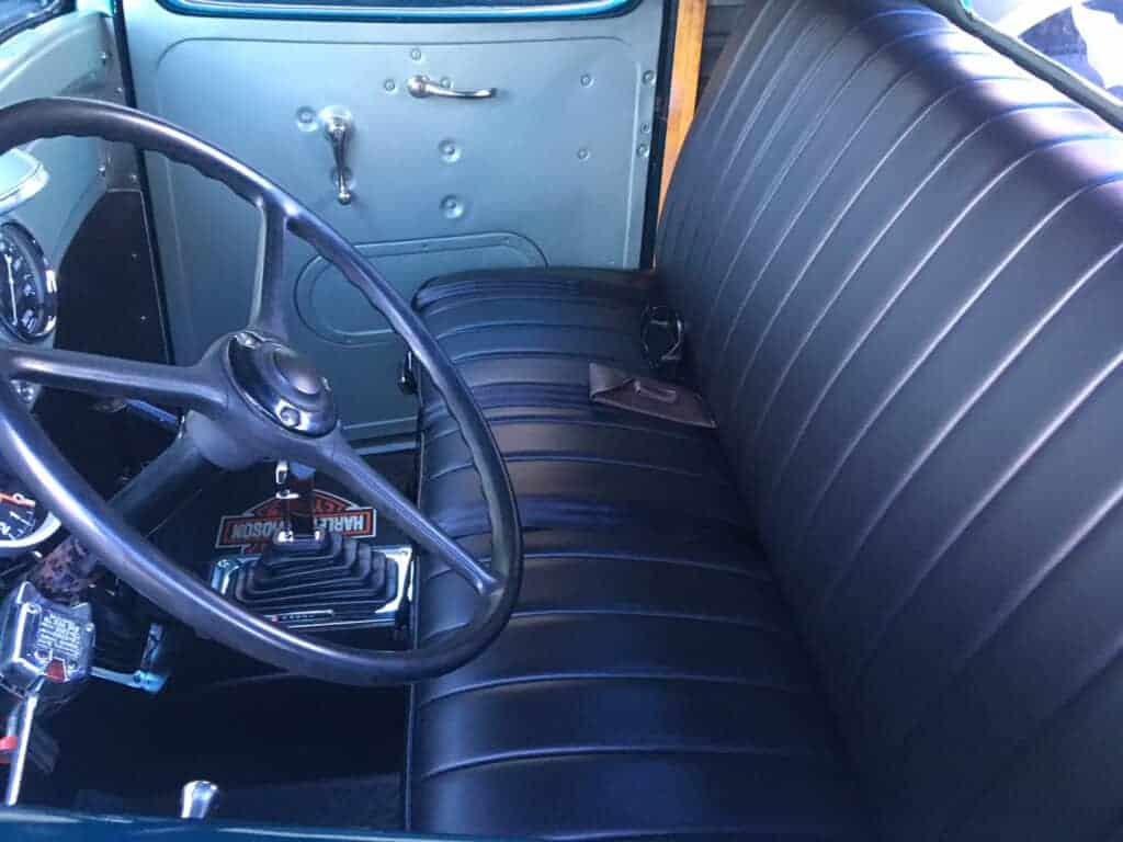 Vintage car interior with leather seats.