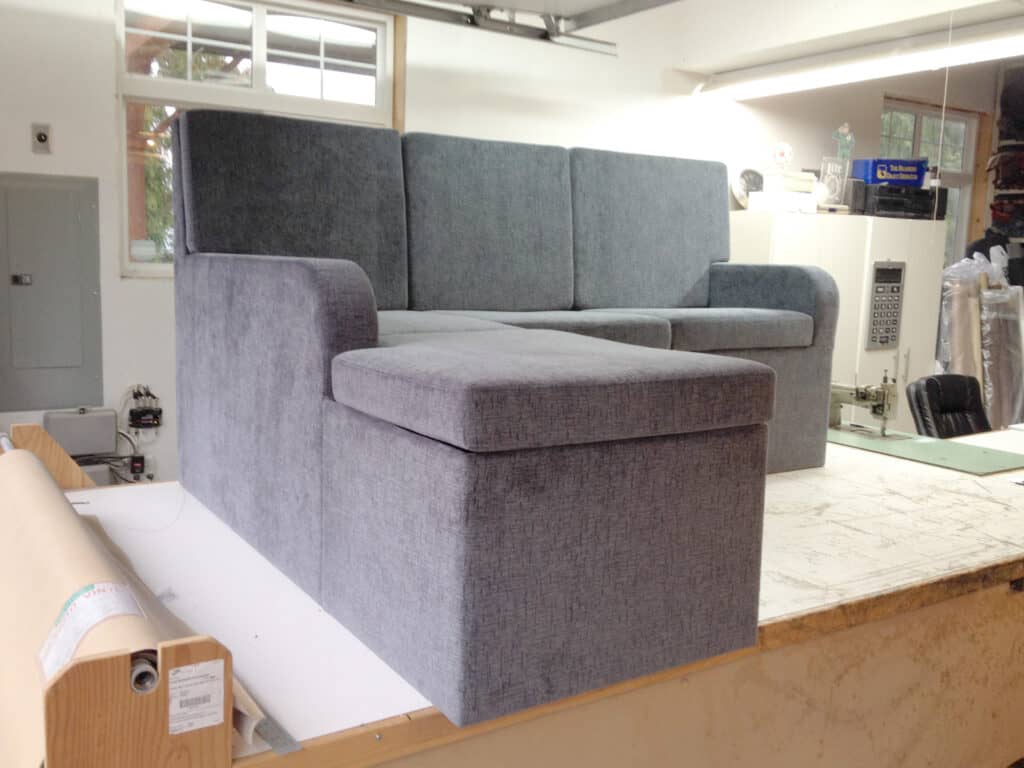 Grey sectional sofa in workshop setting