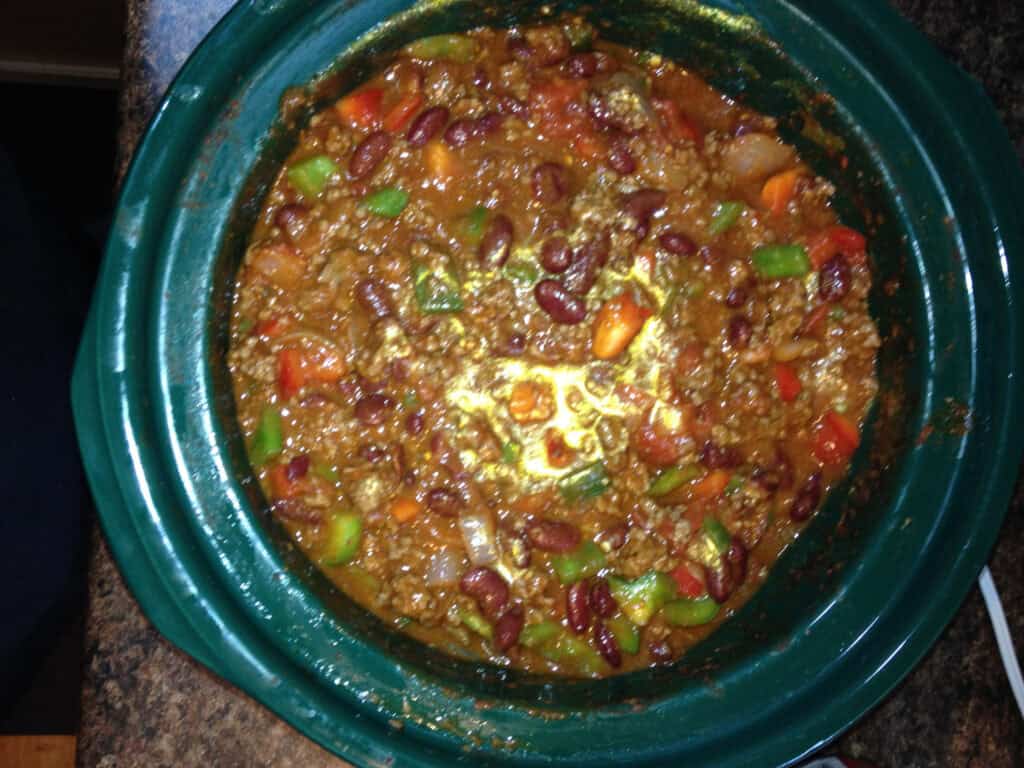 Hearty chili with beans in slow cooker.
