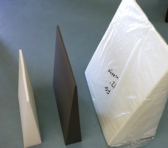 Three different coloured foam wedges on the floor.