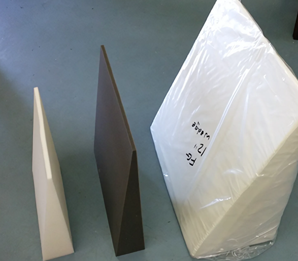 Three different coloured foam wedges on the floor.